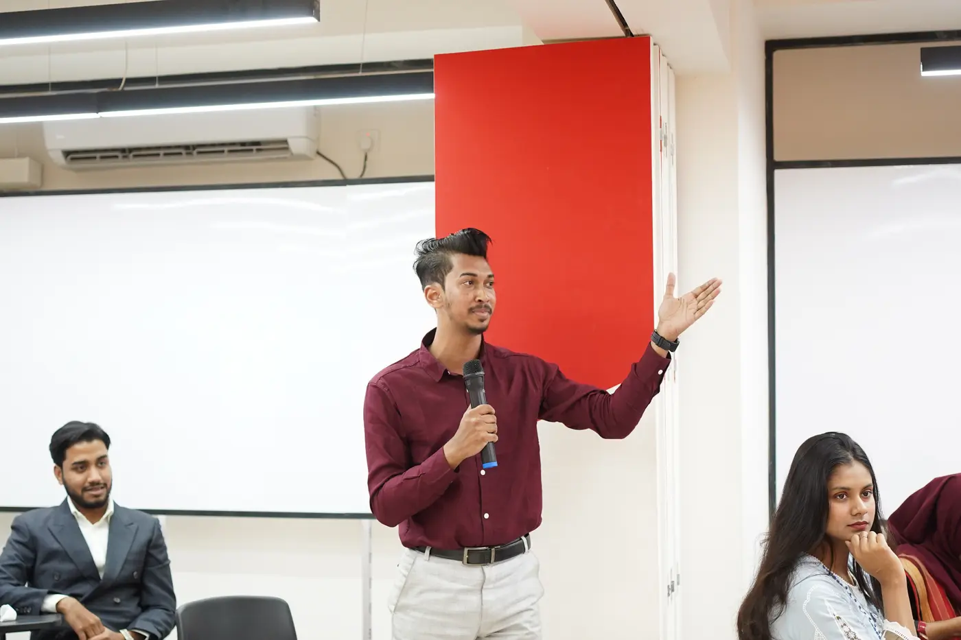 Jobayer speaking with a microphone